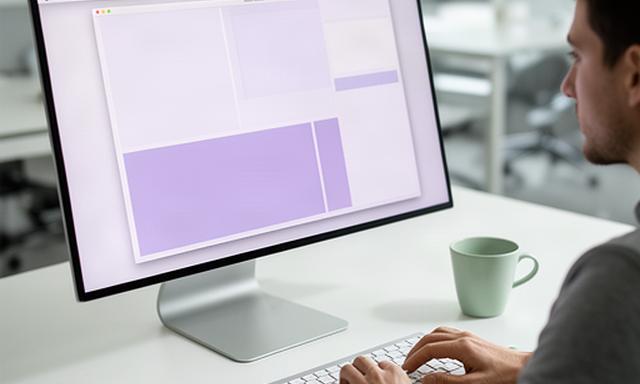 Developer testing a new native Mac application on a desktop workstation